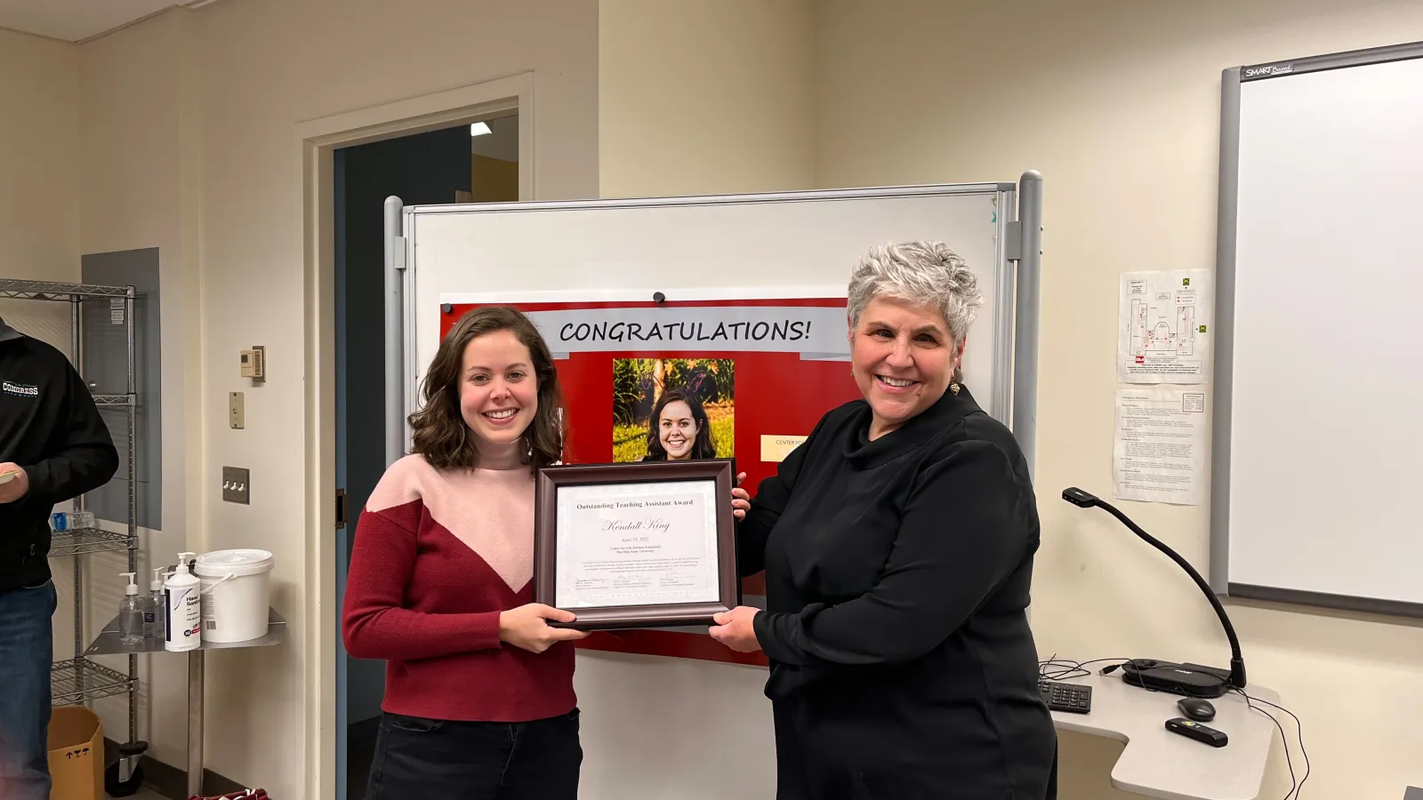 Kendall King receives the 2022 CLSE Outstanding TA Award from CLSE Interim Director Judy Ridgway