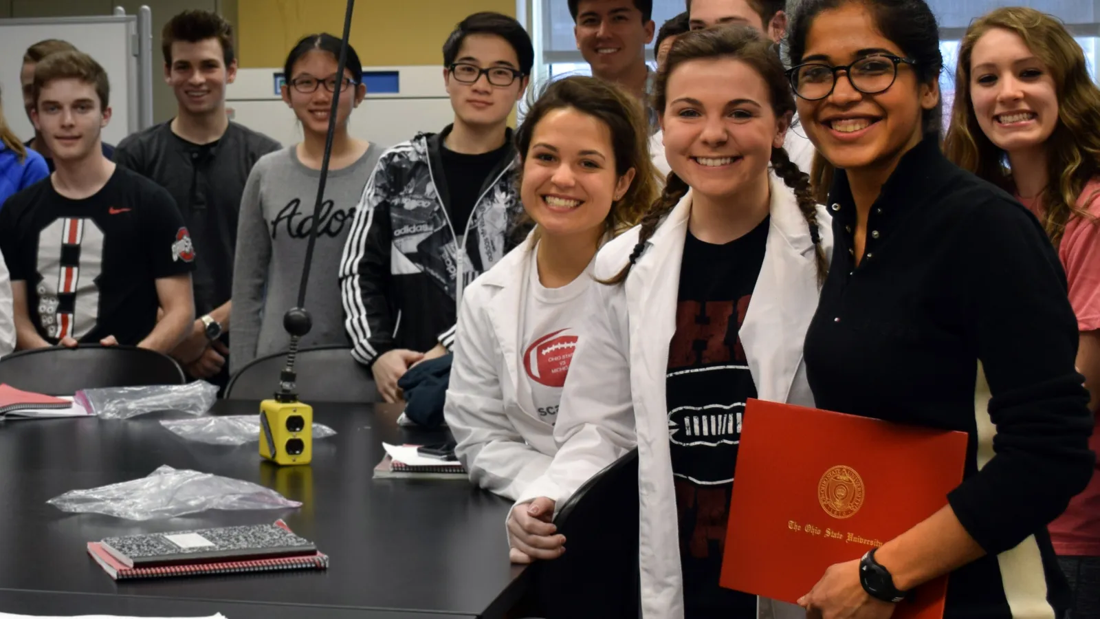 Insiya Fadai with biology students in lab. 