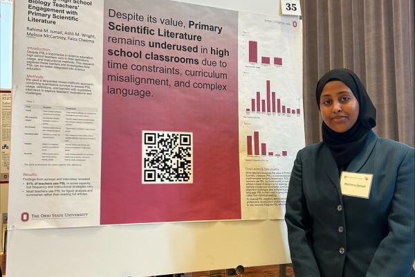 Rahima Ismail with poster at the Denman Undergraduate Research Forum