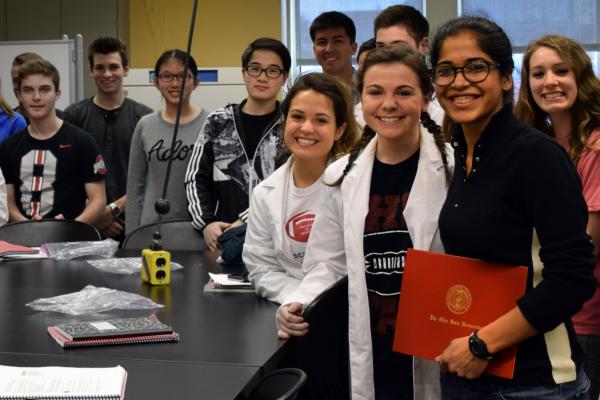 Insiya Fadai with biology students in lab. 