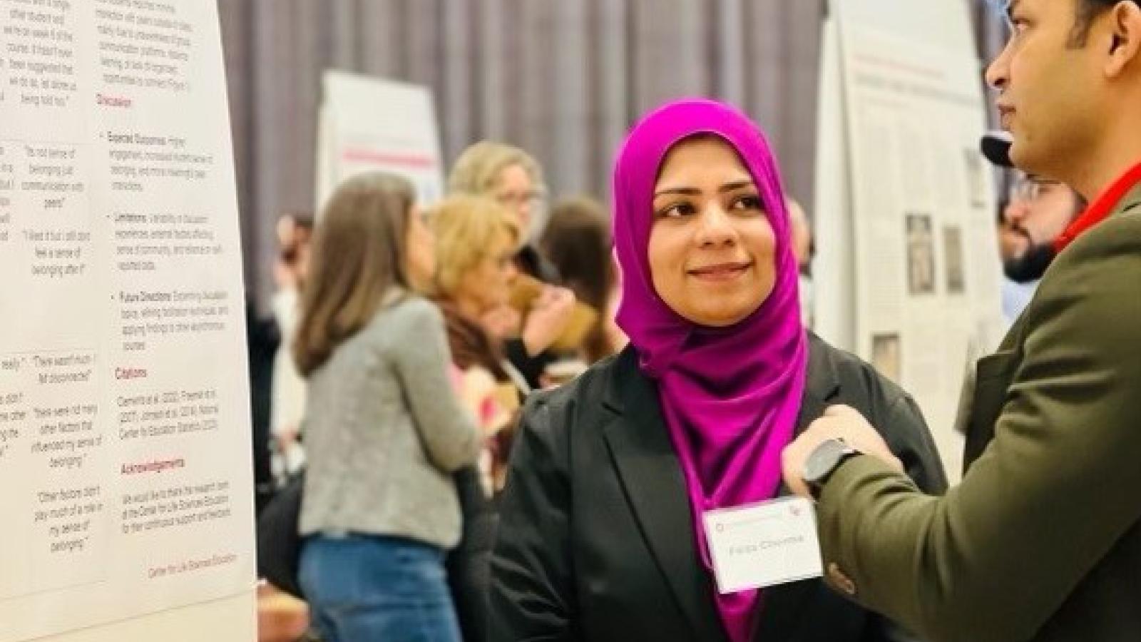 Faiza Cheema presenting poster at the Denman Undergrad Research Forum